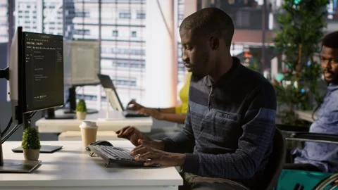 Programmer doing software debugging, asking for help from smiling team leader Stock-Footage 318226494