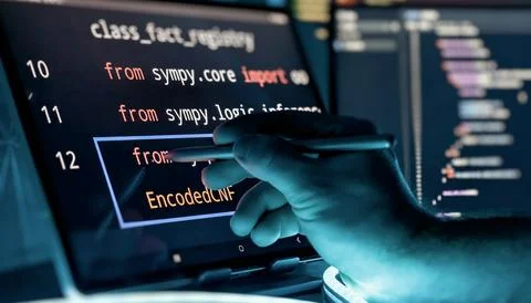Programmer Editing Source Code with Stylus on Touchscreen in Futuristic Softw Stock Photos