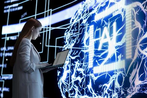 Programmer enforcing AI agent digital guardrails with laptop Stock-Fotos