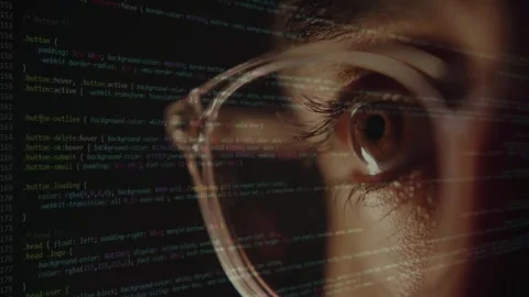 Programmer Eye Close Up with Glowing Computer Code Reflection Stock Footage 335830409