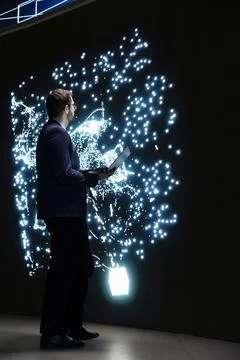 Programmer finetuning artificial intelligence model synaptic weights with laptop 写真素材