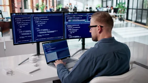 Programmer Focused On Coding New Software Stock Footage 331517160