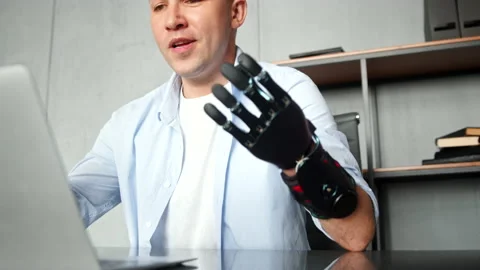 Programmer freelancer man with bio hand prothesis talks Stock-Footage 157347772