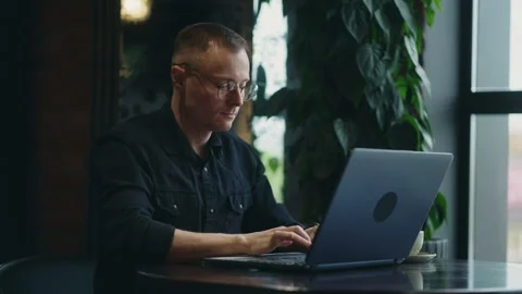 Programmer Freelancer Working Online In Cafe, Remote Job For High-Skilled IT Stock Footage 243311463