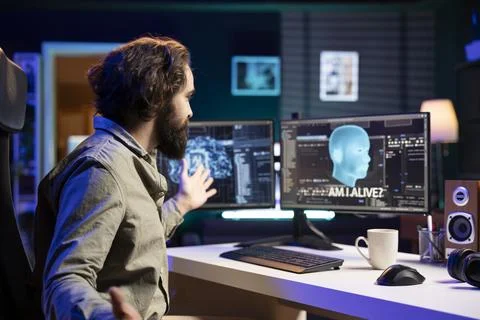Programmer getting interrupted by AI becoming sentient, saluting creator Foto stock
