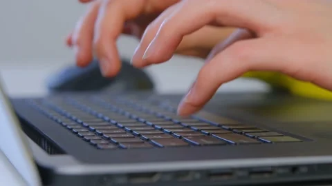 Programmer girl coding on laptop computer in 4k video clip Stock Footage 172190678