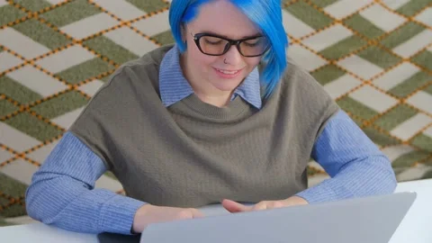 Programmer girl coding on modern laptop computer at home in 4k Stock Footage 198817251