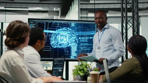 Programmer gives presentation to executives, implementing AI chatbot Stock Footage 323144586