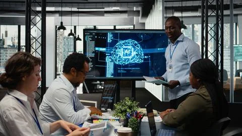 Programmer gives presentation to executives, implementing AI chatbot 写真素材
