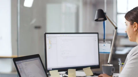 Programmer giving folder to colleague at office Stock Footage 105030323