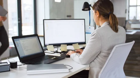 Programmer giving folder to colleague at office Stock Footage 106520029