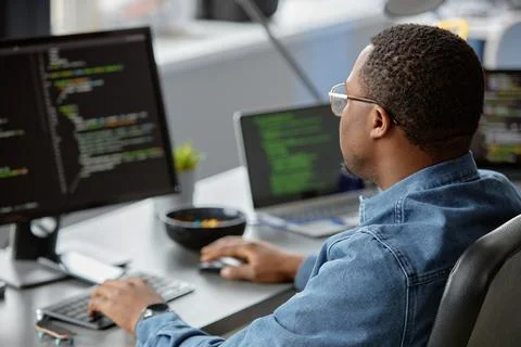 Programmer in Glasses Developing Website Code 写真素材