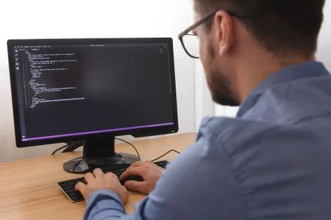 Programmer in Glsses Typing New Lines of HTML Code. Web Design Business and W Stock Photos