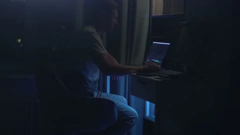 Programmer goes to the computer and turns it off Stock Footage 219716731