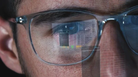 Programmer Hacker works on computer screen - Code is reflected in his eyes Stock Footage 124733072