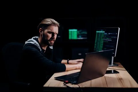 Programmer hacking on computers Stock Photos
