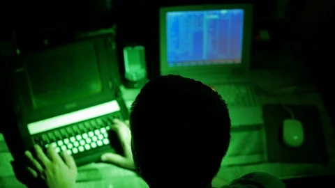 Programmer hacks web site defense and firewalls by command console at laptop Video stock 90718218