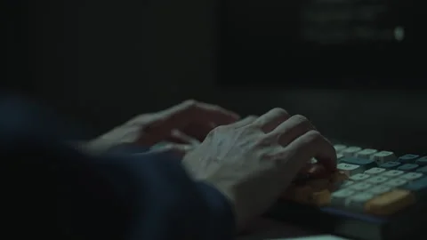 Programmer hands typing on computer keyboard in dark room, programming, coding Stock Footage 323446632