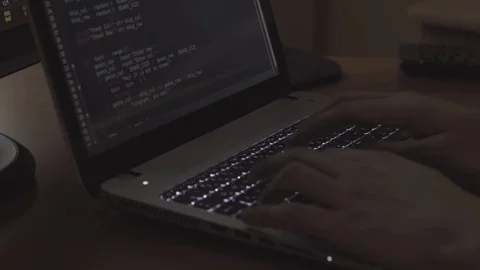 Programmer hands typing on the laptop in dark room Stock-Footage 73455498