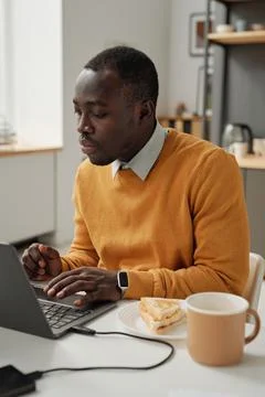 Programmer having lunch at his workplace Stock Photos