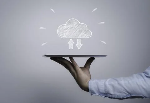 Programmer holding computer tablet with cloud computing drawing icon Stock Photos