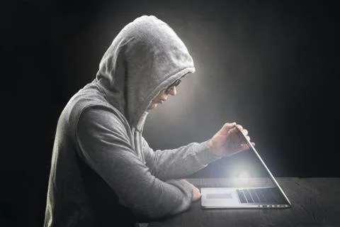 Programmer in the hood and Stock Photos