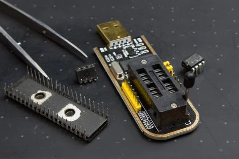 Programmer with inserted microchip memory. electronics repair Stock Photos