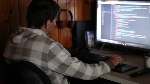 Programmer IT engineer working on project typing data codes Stock Footage 151377599