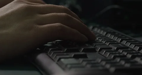 The programmer is knocking on the keyboard at night, 4K, R3D Stock Footage 108673634