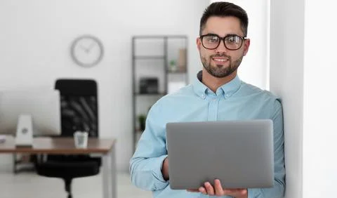 Programmer with laptop in office. Banner design Stock Photos