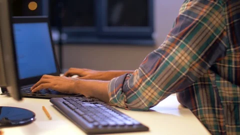 Programmer with laptop working at night office Stock Footage 88046764
