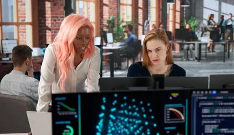 Programmer Leads Diverse Team Analyzing AI Training Data For Future Solutions Stockfoto's