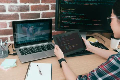 Programmer looking at mobile digital tablet pad Foto stock