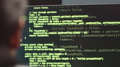 Programmer Looking at Sophisticated Code on Desktop Computer Stock Footage 247627335