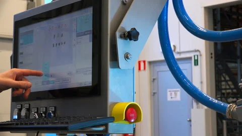 The programmer makes the settings on the display Stock Footage 92902338