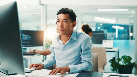 Programmer, man and reading computer in office for software development, typing 写真素材