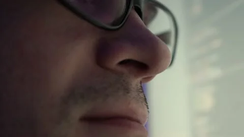 Programmer, a man in front of a computer, the code is reflected in the glasses. Stock Footage 206320803