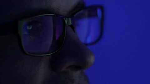 Programmer, a man in front of a computer, the code is reflected in the glasses. Stock Footage 219202581