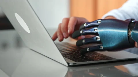 Programmer man hands with artificial bio prothesis type Stock-Footage 157331223