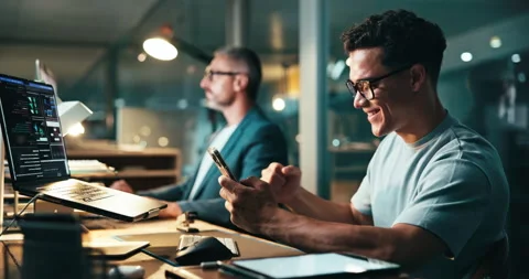 Programmer, man or excited in office with phone, project opportunity or code on Video stock 301628636