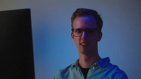 Programmer Man Portrait, Young man wearing glasses, working on computer Stock Footage 220022157