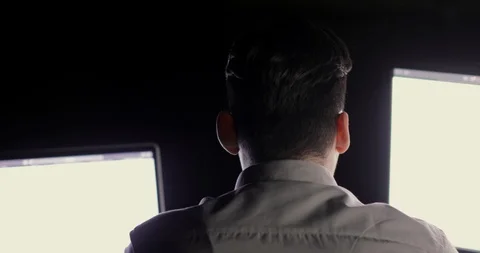 Programmer man is working in the office overtime late at night sitting before Stock Footage 105301984