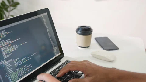 Programmer man writing program code sitting at workplace in office Stock Footage 202110185
