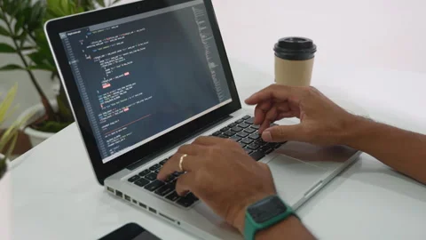 Programmer man writing program code sitting at workplace in office Stock Footage 248617441