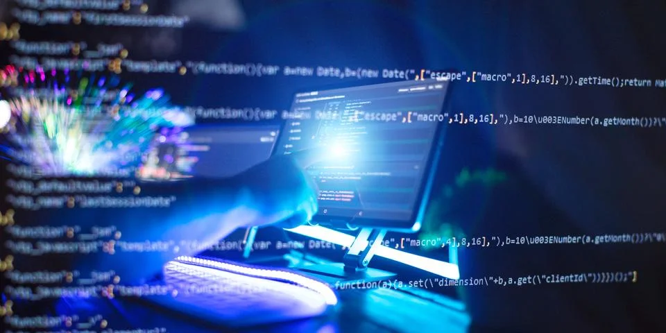 Programmer manually working with program code on a computer at night in a d.. Photos