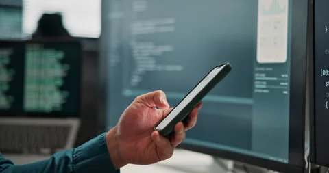 Programmer, message and hand with phone in office, software development and Stock Footage 346957996