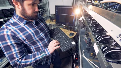 Programmer mining a cryptocurrency. Stock Footage 92411255