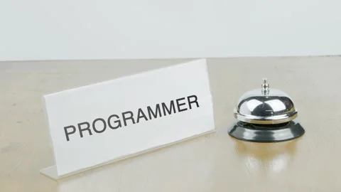 Programmer Office or Room with Hand Ringing The Bell on Desk or Table Stock-Footage 300798414