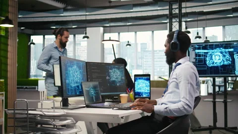 Programmer in office relies on AI machine learning to automate repetitive tasks Stock Footage 313018256