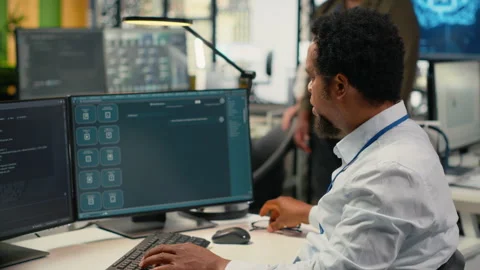 Programmer in office using AI LLM chatbot to get help Stock Footage 323406403